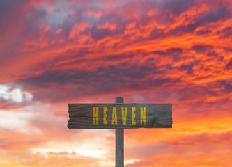 Heaven sign on sunset background god concept
