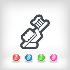 Hand holding toothpaste and toothbrush