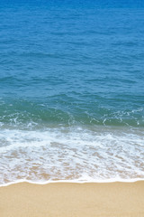 Soft wave of ocean on sandy beach