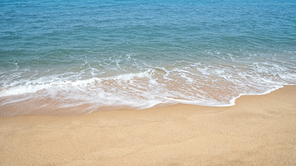 Soft wave of ocean on sandy beach
