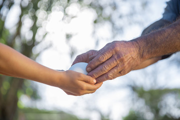 Children hand hold a egg