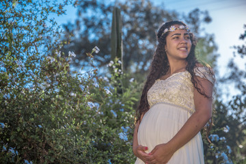 Naklejka premium Beautiful young pregnant woman