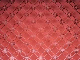 An abstract shot of fine red painted wire lattice