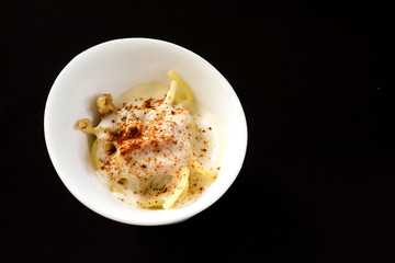 tagliatelle macaroni with cheese and basil on a wooden table. top view. pasta to take out in box.