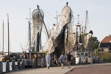 Fishing boats are mooring in the harbor
