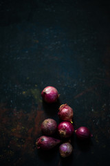 Onion on black vintage background