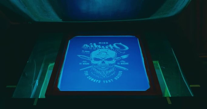 Silk screen printing process - forming a stencil from a screen with of a piece of mesh stretched over a frame. 4K UHD