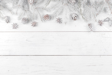 Christmas composition. Frame made of fir branches on white wooden background. Christmas, winter concept. Flat lay, top view, copy space