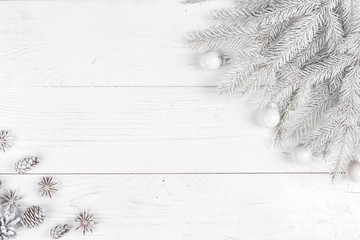 Christmas composition. Frame made of fir branches on white wooden background. Christmas, winter concept. Flat lay, top view, copy space