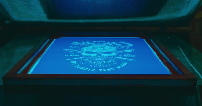 Silk screen printing process - forming a stencil from a screen with of a piece of mesh stretched over a frame. 4K UHD
