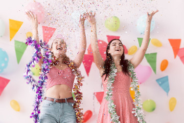 Young beautiful women celebrate holiday party and dancing.Best friends wearing dress,casual shorts and T-shirt,having fun in holiday.Pastel tone.