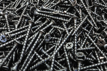 Black self-tapping screw. Screws for construction work.