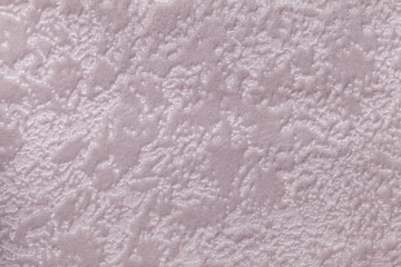 Pearl lilac background from a soft upholstery textile material, closeup.