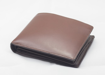 Money in brown leather wallet full of cards on white background