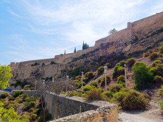 Fototapeta na wymiar Fragment of the walls of the Castillo de Santa Barbara in Alicante, Spain.
