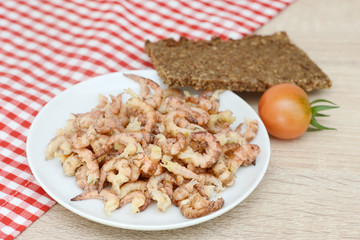 north sea crabs in the bowl  and black bread on table