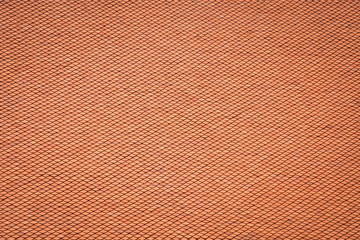 Thai old style rooftop pattern design, layer of red clay tiles roof texture background