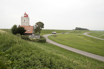 Fototapeta na wymiar Historical light house De Ven in Oosterdijk