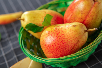organic pears laying down on a lightly dotted kitchen cloth
