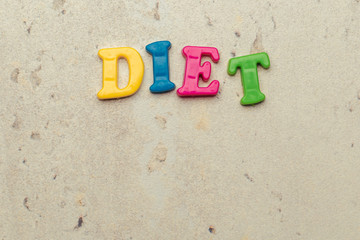 The word Diet written in plastic colorful letters