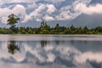 clouds mist lake reflections mountains