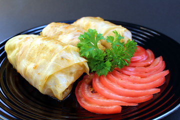 cooked daisies on a plate with tomatoes and herbs