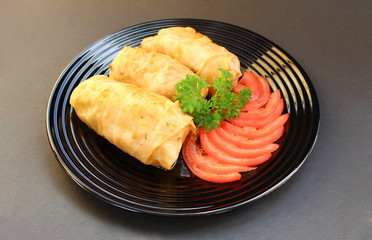 cooked daisies on a plate with tomatoes and herbs