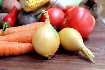 Assembled fresh autumn crop of onion vegetables