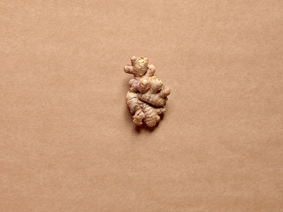Fototapeta na wymiar Isolated ginger root over a brown background in studio.