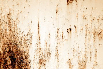 Grungy rusted metal surface in orange tone.