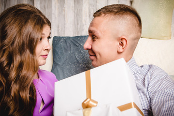 Couple in the room with the gifts