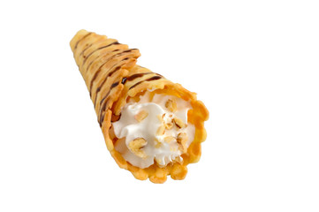 Delicious honeyed waffles, twisted into cones with cream, nuts, chocolate topping isolated on white...