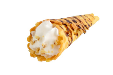 Delicious honeyed waffles, twisted into cones with cream, nuts, chocolate topping isolated on white background.