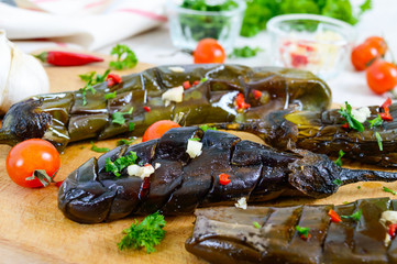 Baked eggplant, garlic, fresh herbs - ingredients for a snack 
