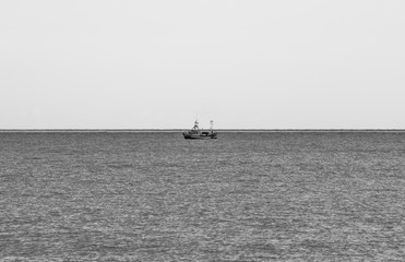 Fishing boat in the ocean, isolated