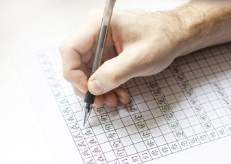 The men writting in sheet of paper with Chinese characters, the beginning of learning Chinese,...
