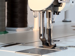 Industrial sewing machine with walking foot close-up