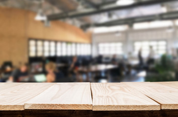 Selected focus empty brown wooden table and Coffee shop or restaurent blur background with bokeh image. for your photomontage or product display