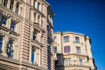 Fototapeta na wymiar classical style buildings against a blue sky