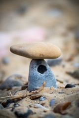 Beach stones stacked on top of each other at a pebble beach
