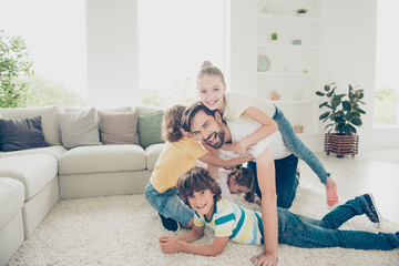 Careless concept rest relax sofa. Cheerful,beautiful kids olay o