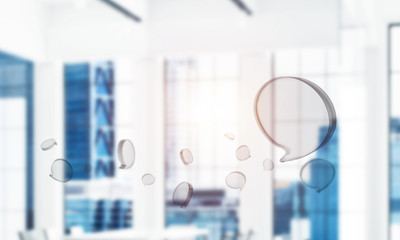 Concept of communication by glass empty chat icon on office back