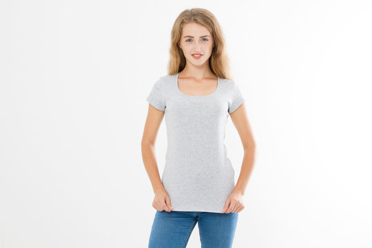 Young blonde woman with fit slim body in blank template t shirt and jeans isolated on white background. Skin and hair care. Copy space and mock up