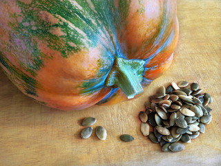 Still life with pumpkin and pumpkin seeds