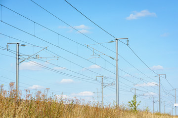 Overhead line equipment of the LGV Est, the East European high-speed railway line, made of posts, catenaries, wires and power lines to supply electricity to bullet trains.