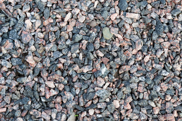 Background of red and gray granite rubble