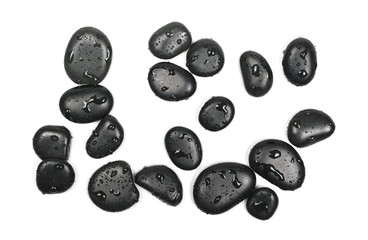 Black spa stones with water drops isolated on white background, top view
