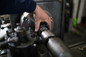 Metallurgy heavy industry. Factory for production industrial machines. Low light close up shot. Short depth of field.