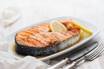 grilled salmon with lemon on dish