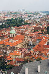 Fototapeta na wymiar aerial view of prague old town cityscape with rooftops, Charles Bridge and Vltava river